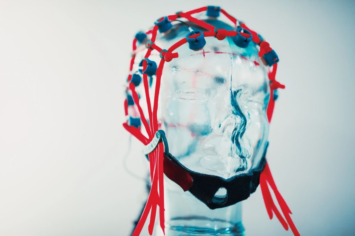 Full EEG cap on a glass demonstration head